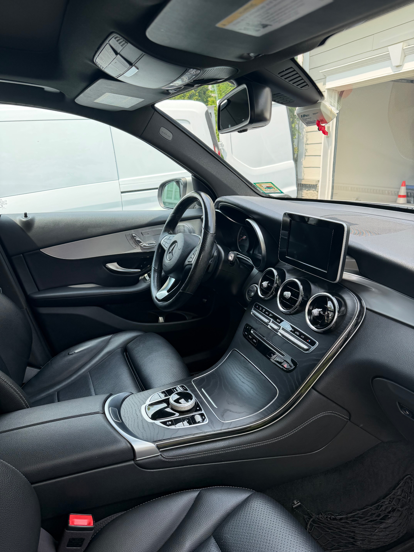 Detailed black leather interior and console of a Mercedes GLC