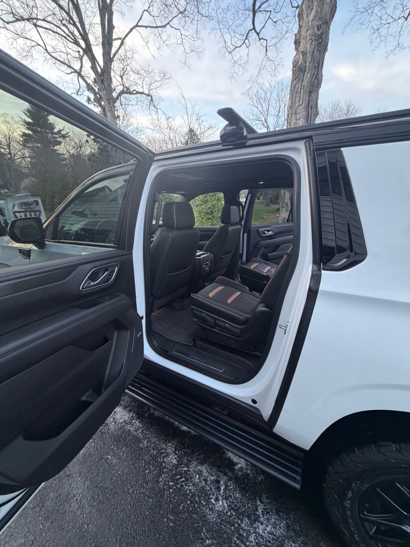 Clean leather interior and door panels of a white Chevrolet Tahoe