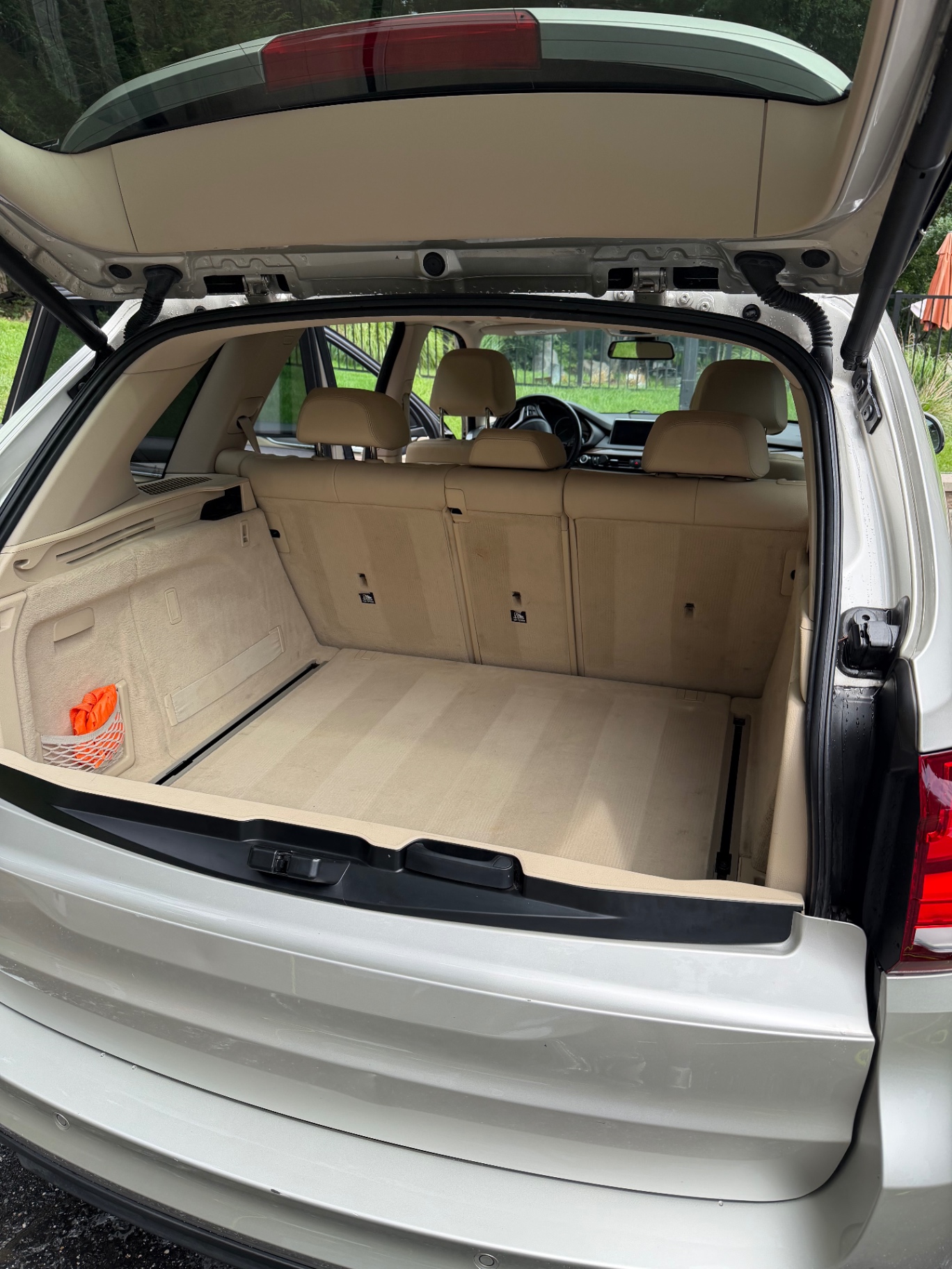 Tan SUV cargo area shampooed and detailed
